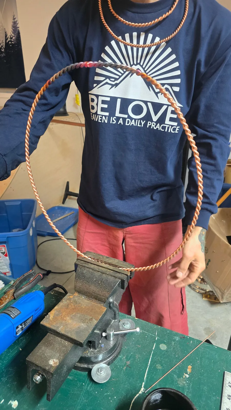 Copper being twisted by hand at the vise