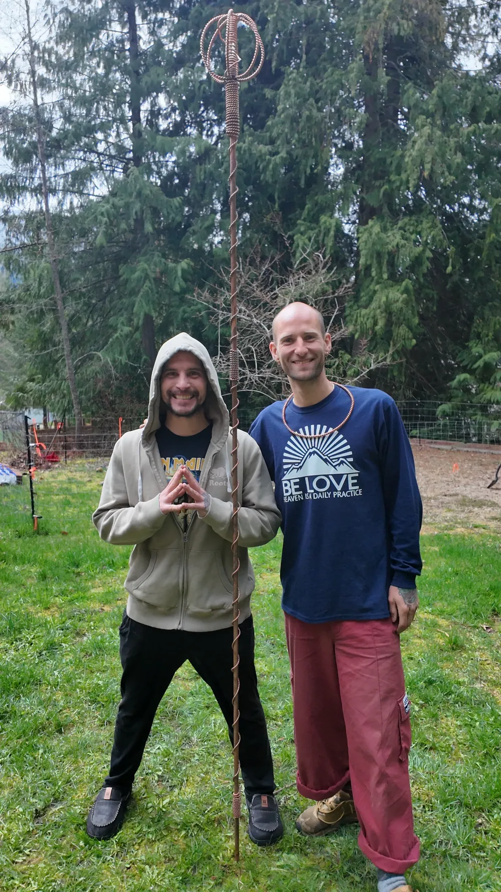 Spence Madden and Steven Dalgarno standing on the Land beside a Harmonizer Antenna System