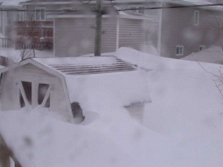 Deep snow covering a storage barn in Newfoundland, Canada
