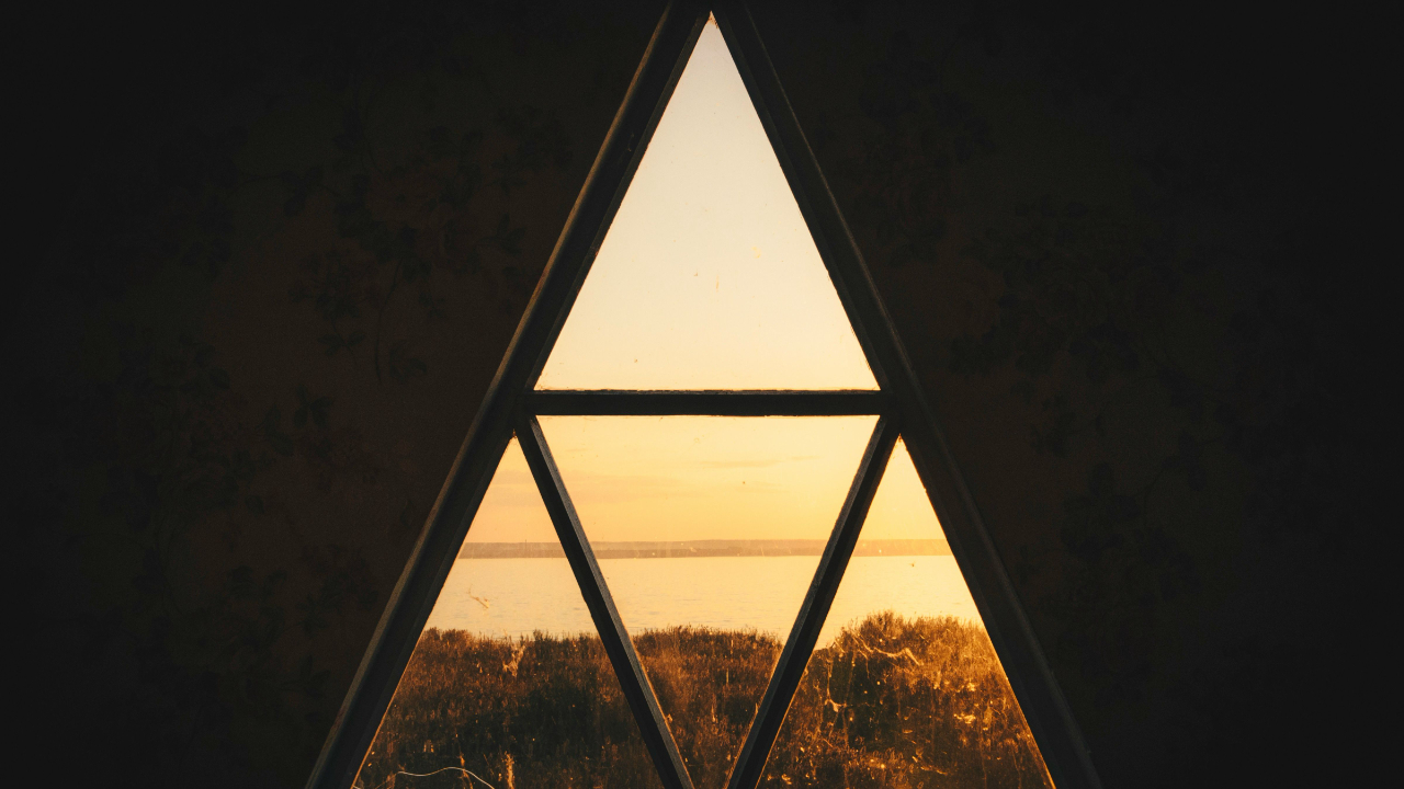 a veiw through a window made up of 4 triangles