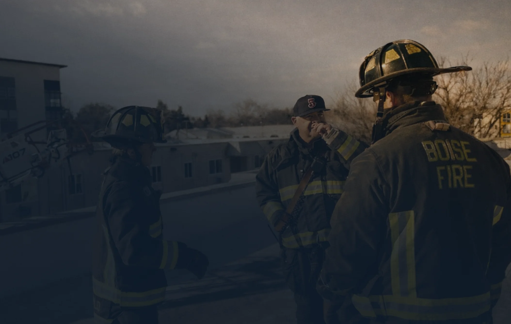 Rob with Boise Fire crew members in turnout gear at dusk