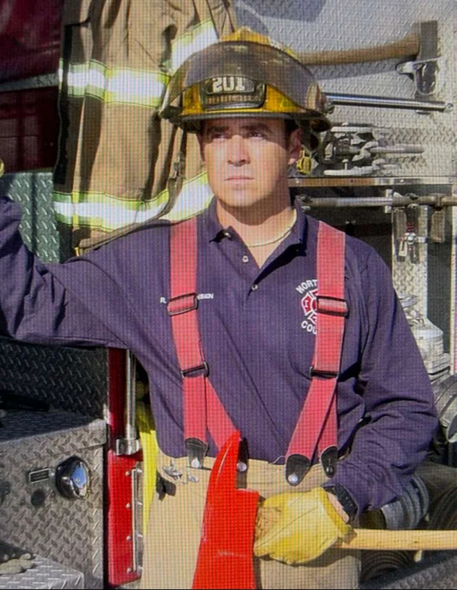 Rob Z Christensen in his fire service helmet and turnout gear