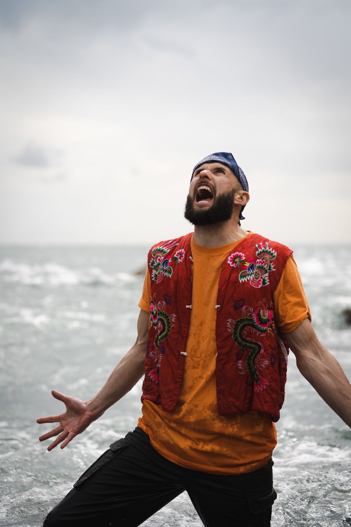 Chris Geisler shouting by the sea