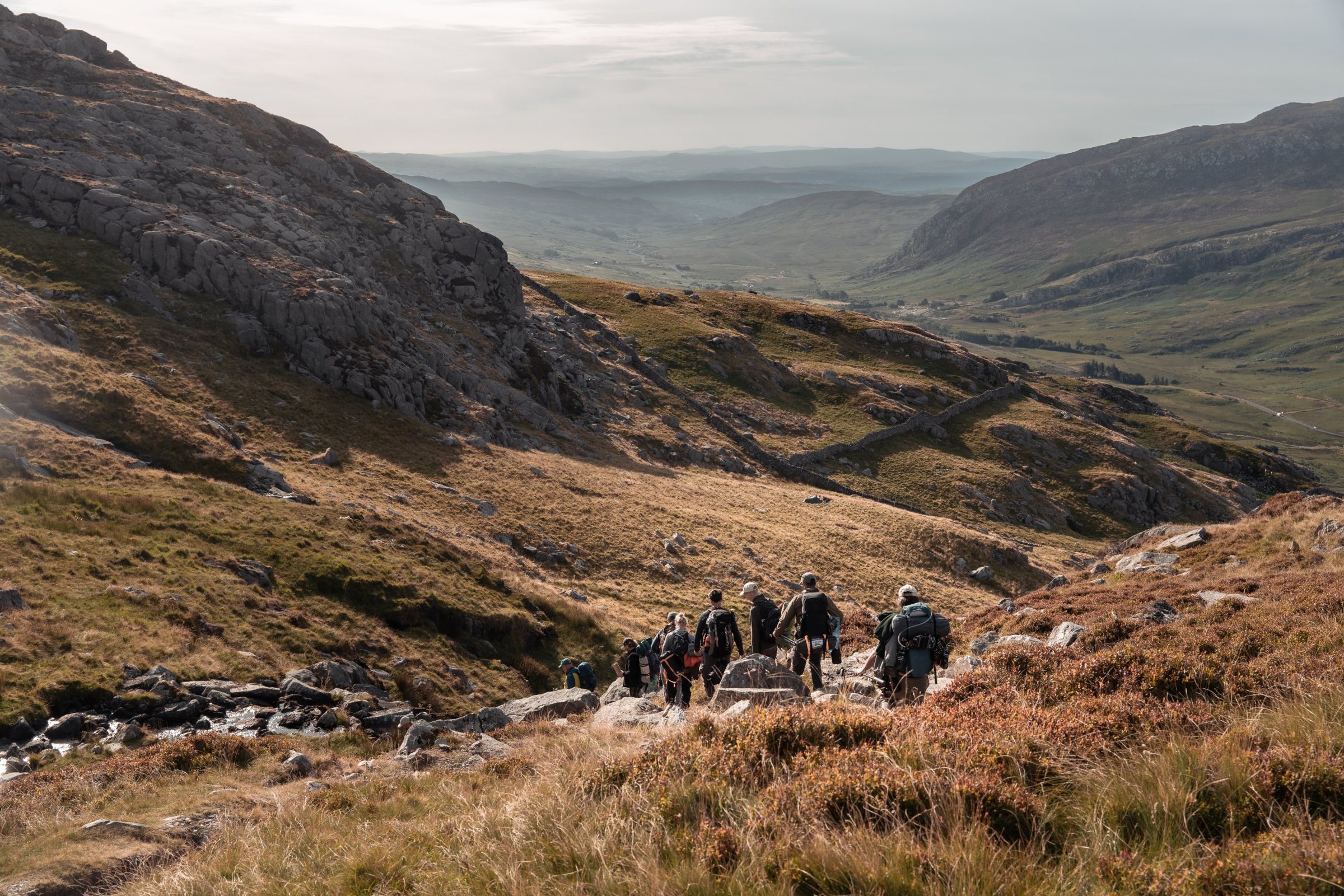 Men walking down a mountain valley