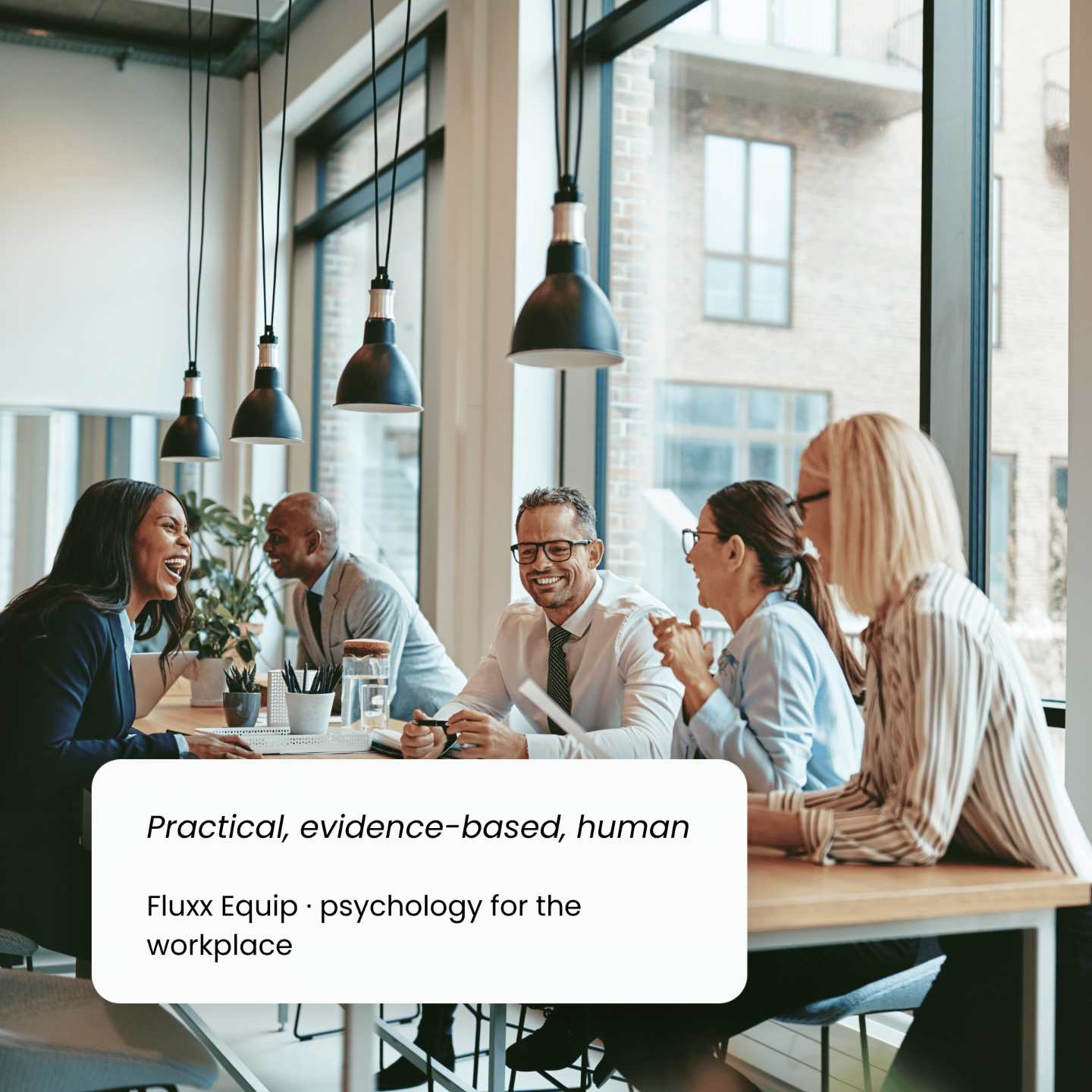 Workplace team collaborating, representing Fluxx Equip psychology-led organisational support