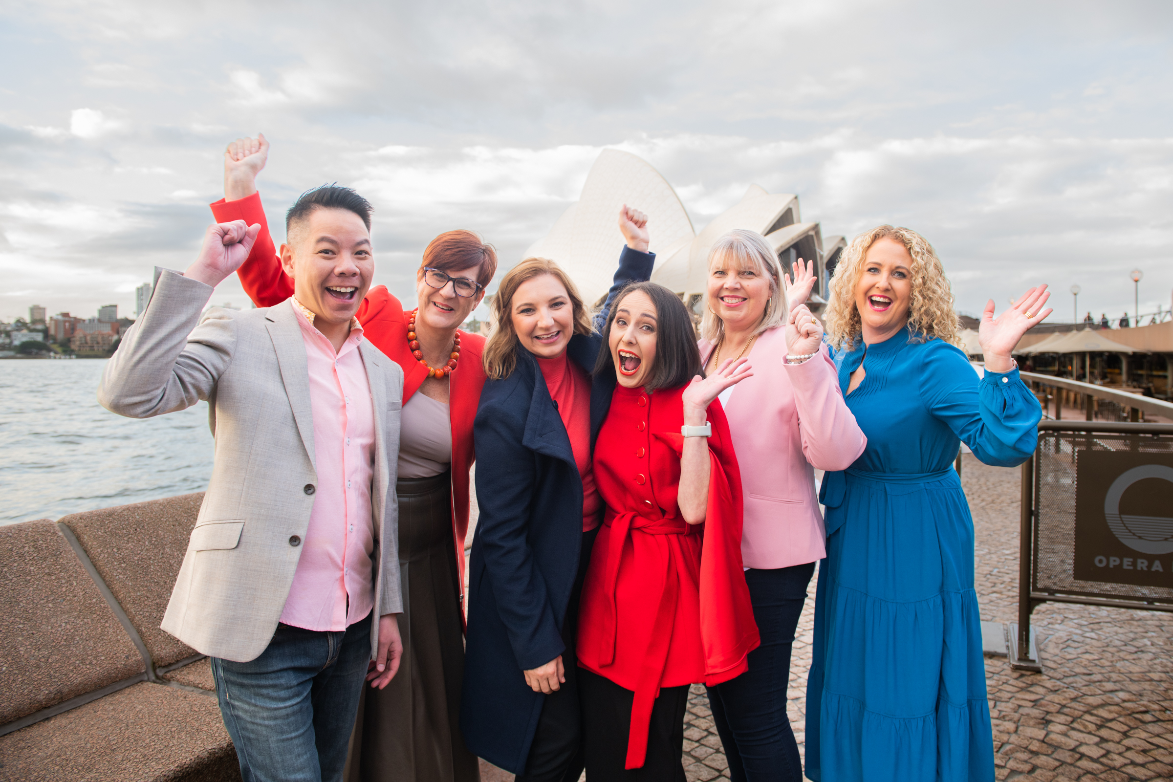Roslyn Ranse celebrating with travel advisors in front of the Sydney Opera House
