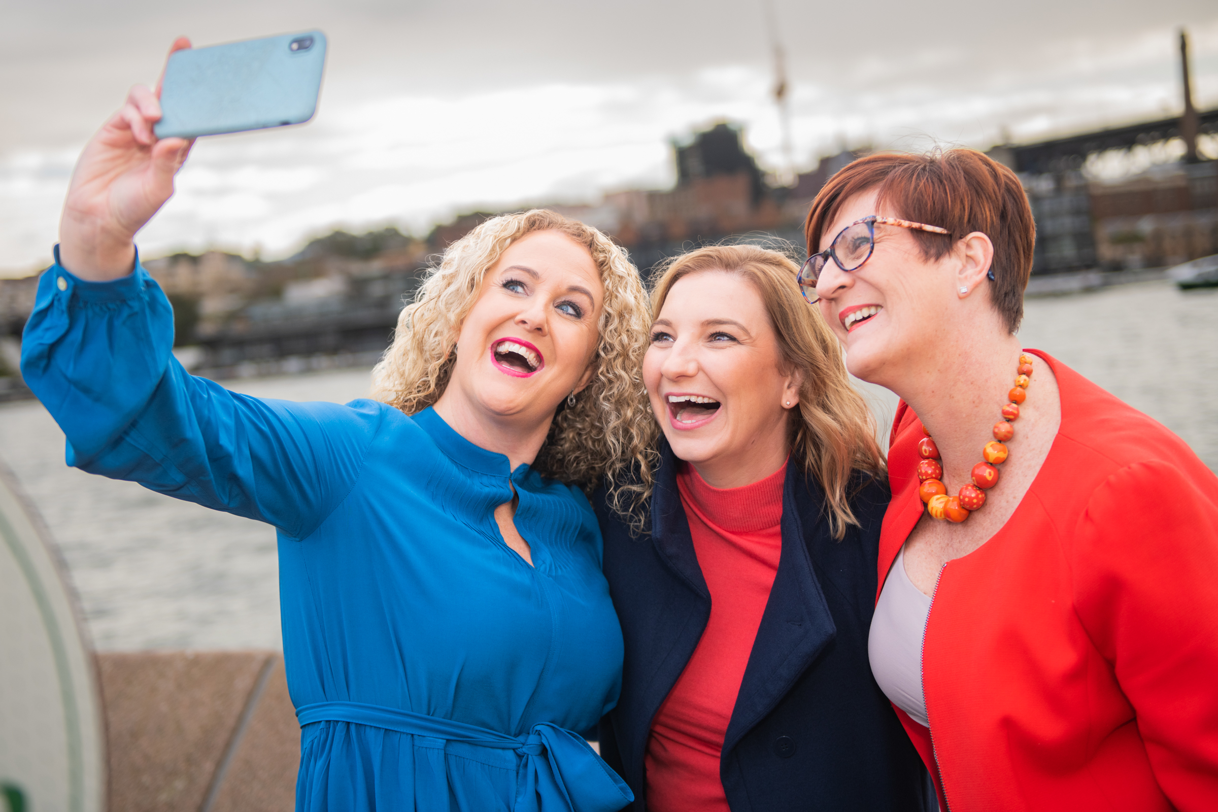 Roslyn Ranse taking a selfie with two travel advisors by Sydney Harbour