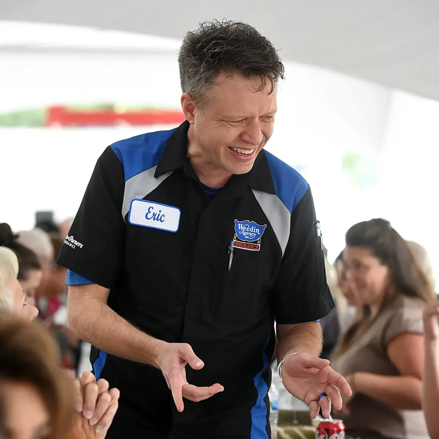 Eric Weedin speaking with members of the community