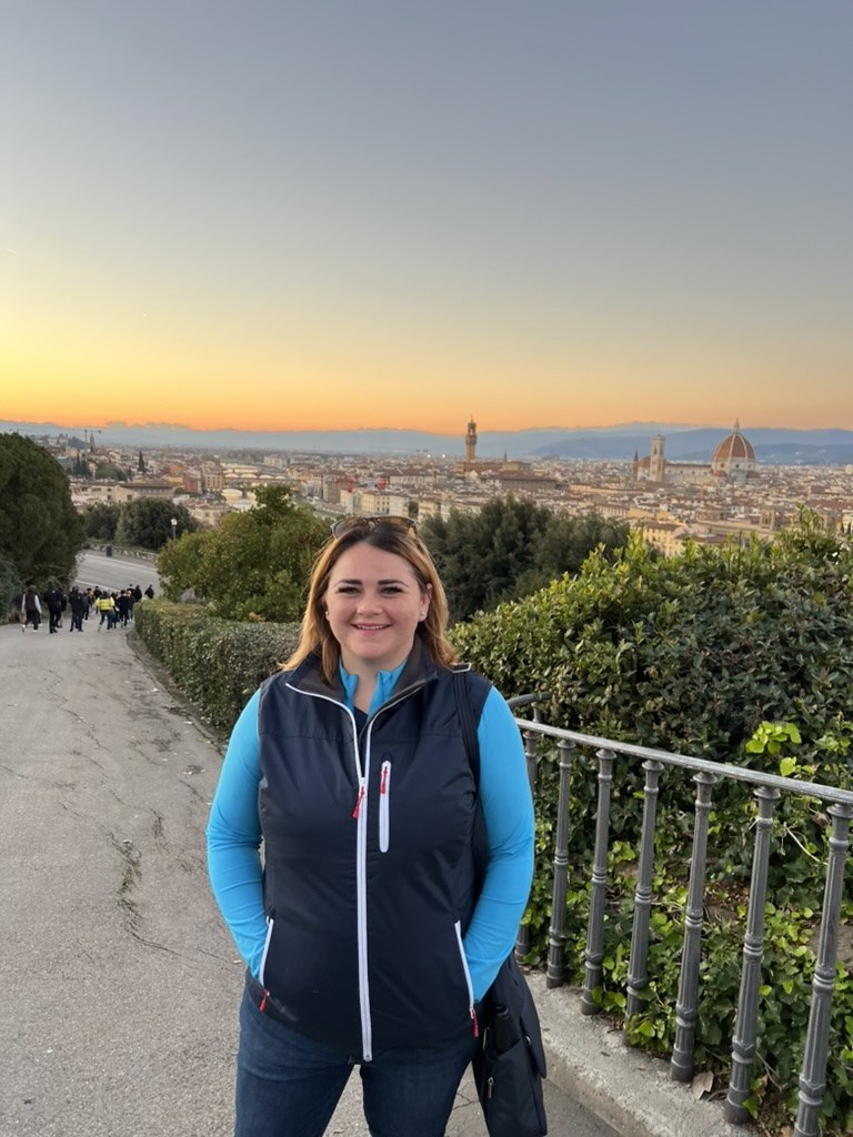 River at sunset above Florence, Italy, during her first solo trip in December 2023