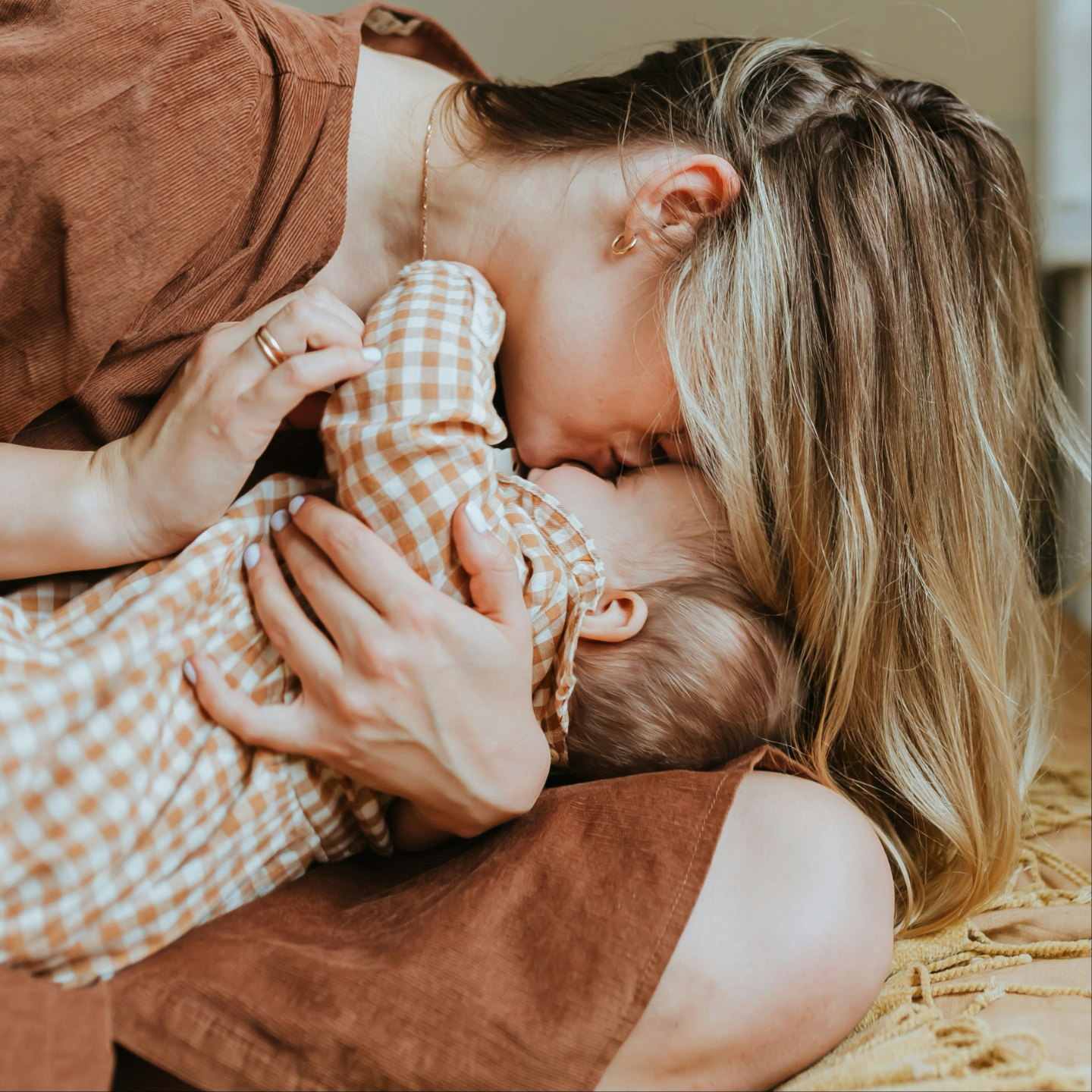 Mother kisses baby Education and Homeschooling Category Icon