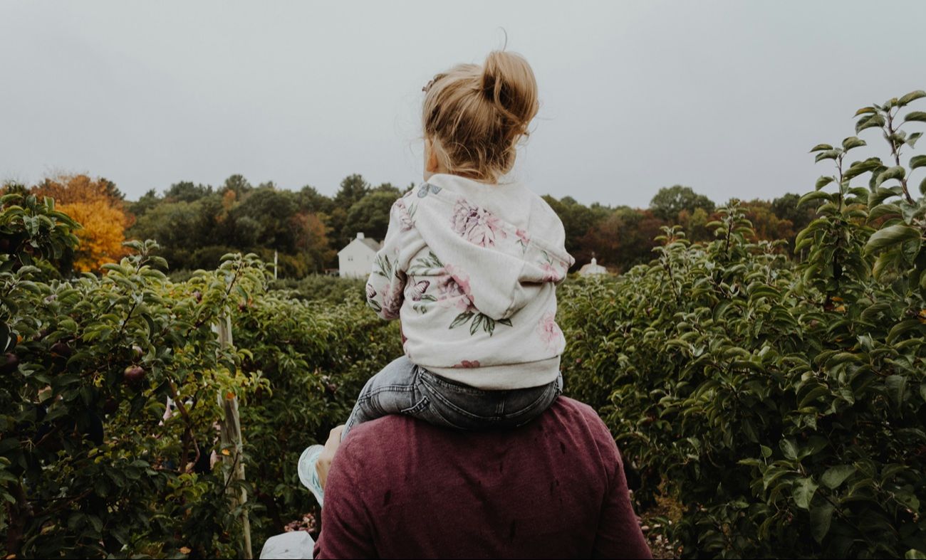 father and daughter in the garden homeschooling as a family
