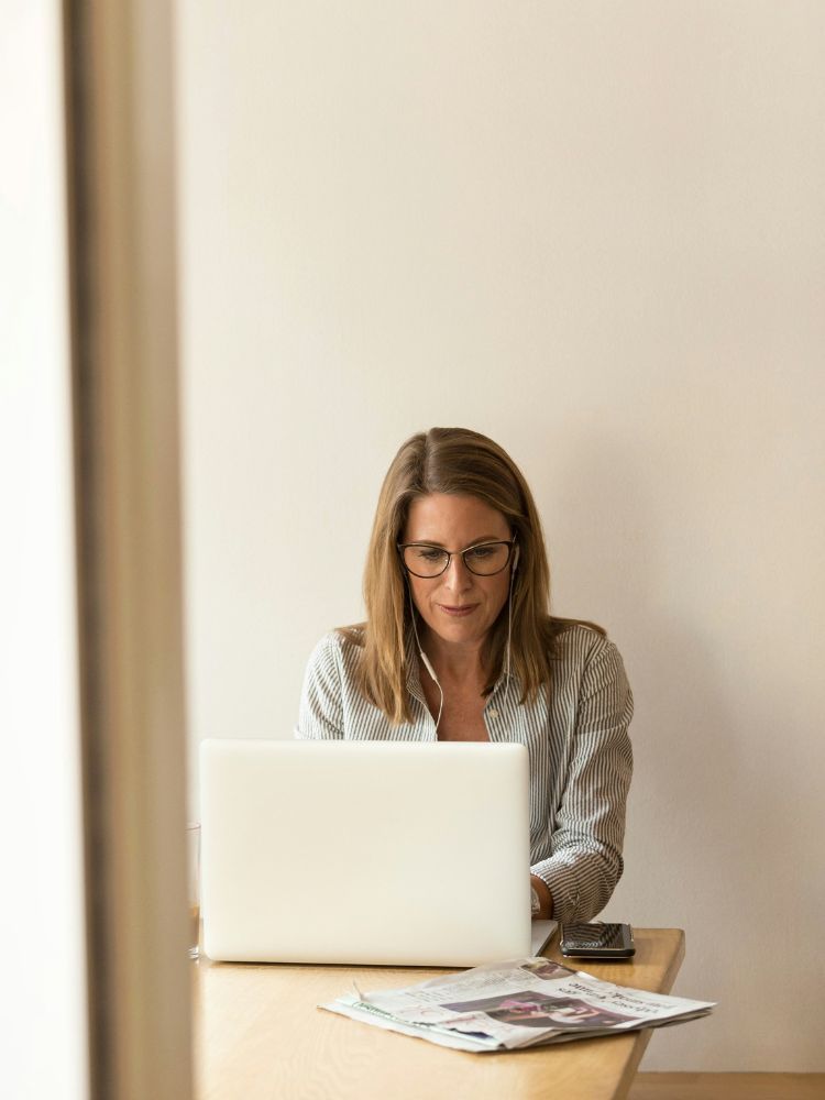 Content woman at laptop.