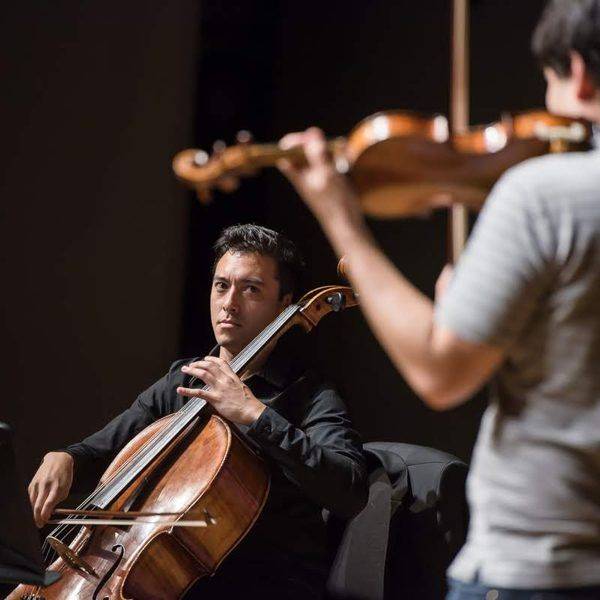 Josh performing a cello solo in concert