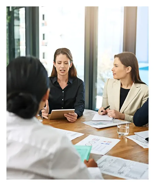 Employer team reviewing alternative funding performance data