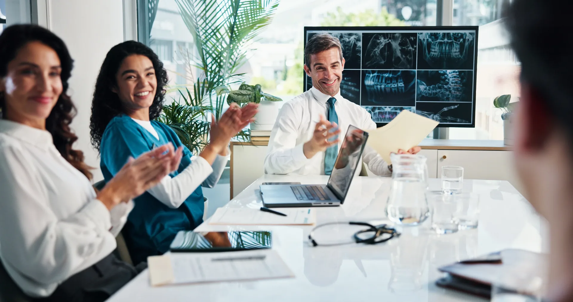 Employer leadership reviewing benefits data