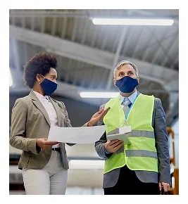 Site supervisors reviewing workplace safety procedures