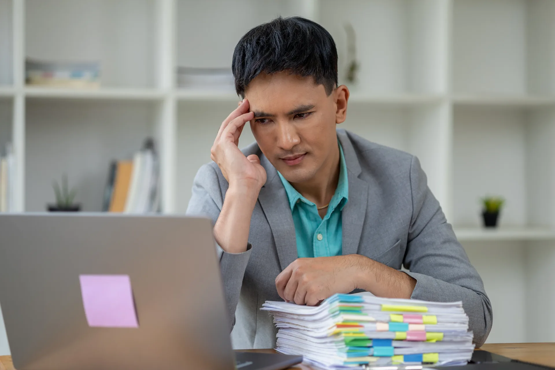 Executive reviewing fragmented workforce cost reports