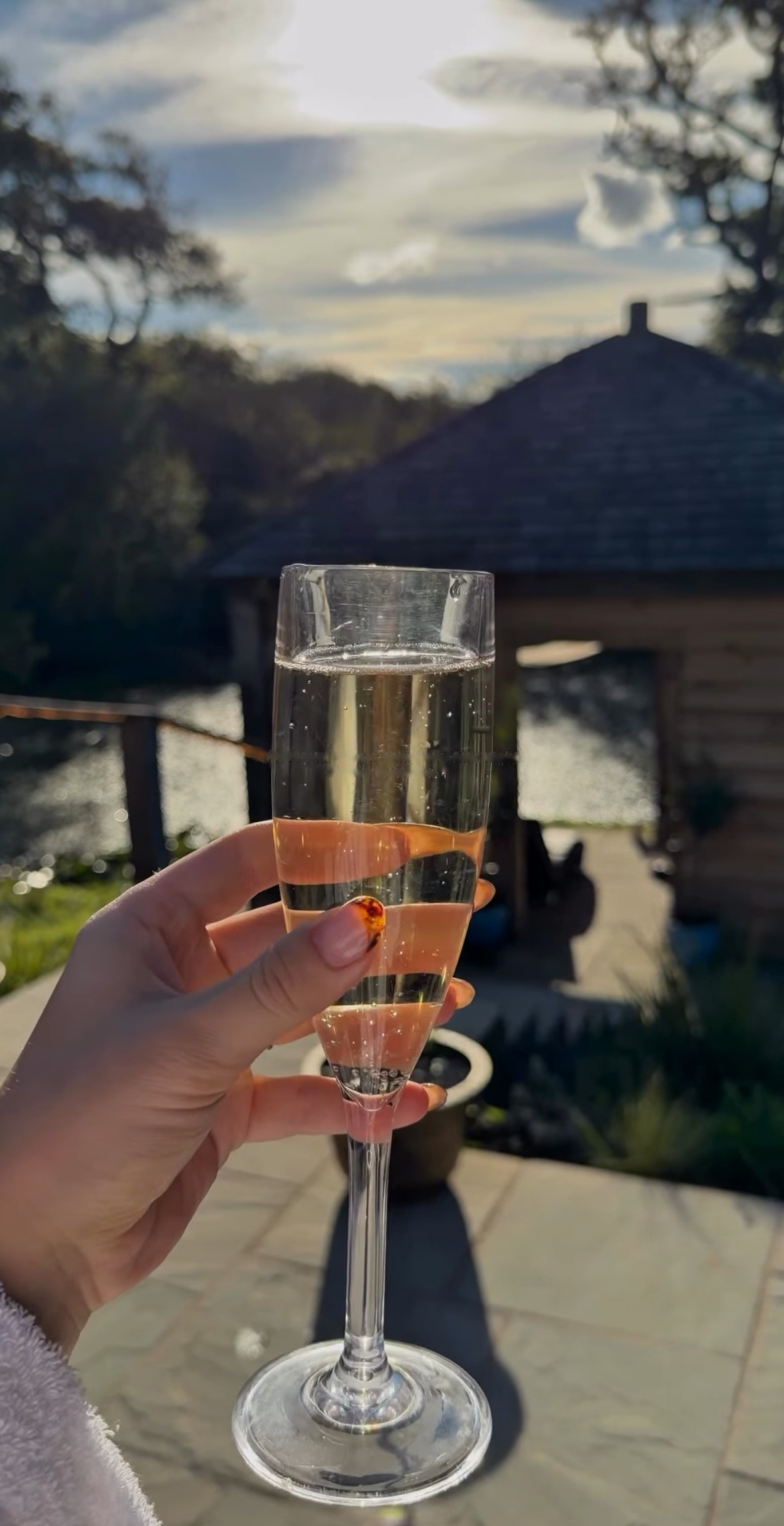 A glass of prosecco by the lake