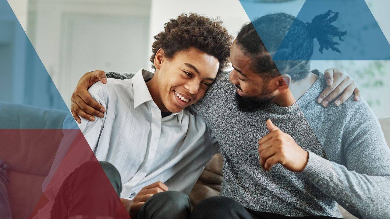 teen talking and laughing with his dad