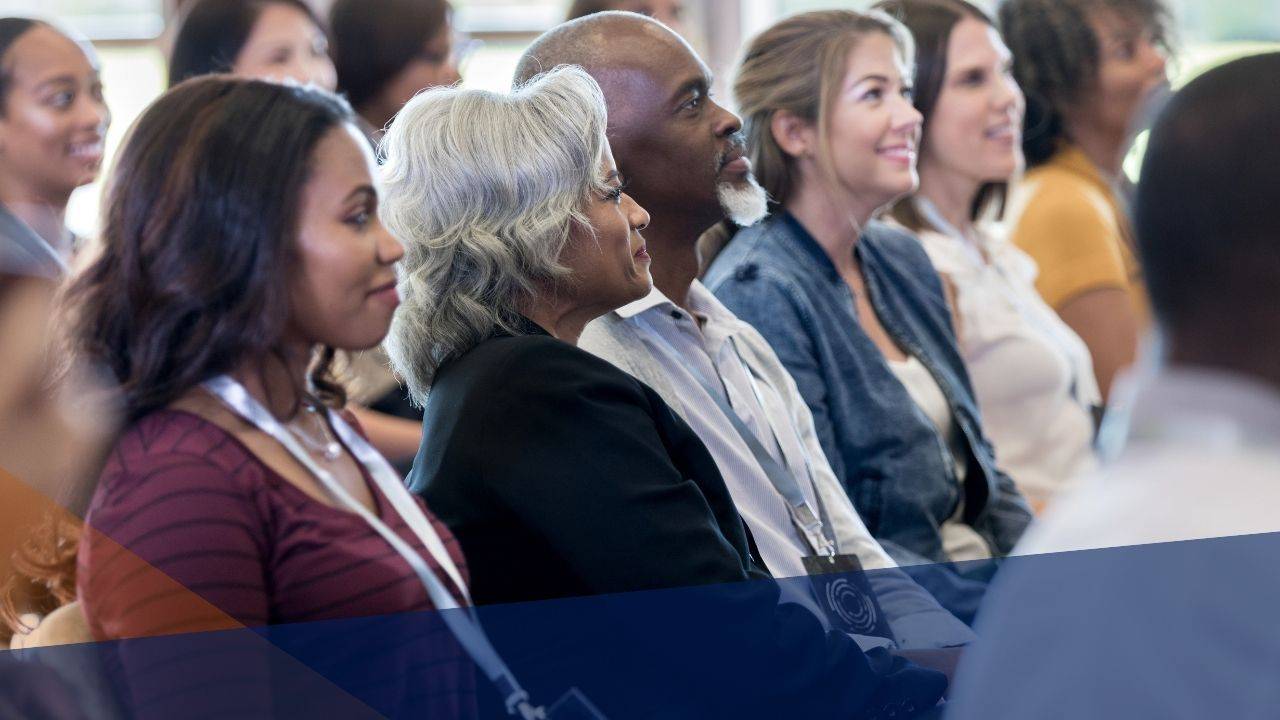 Workshop participants seated in a circle during a group discussion