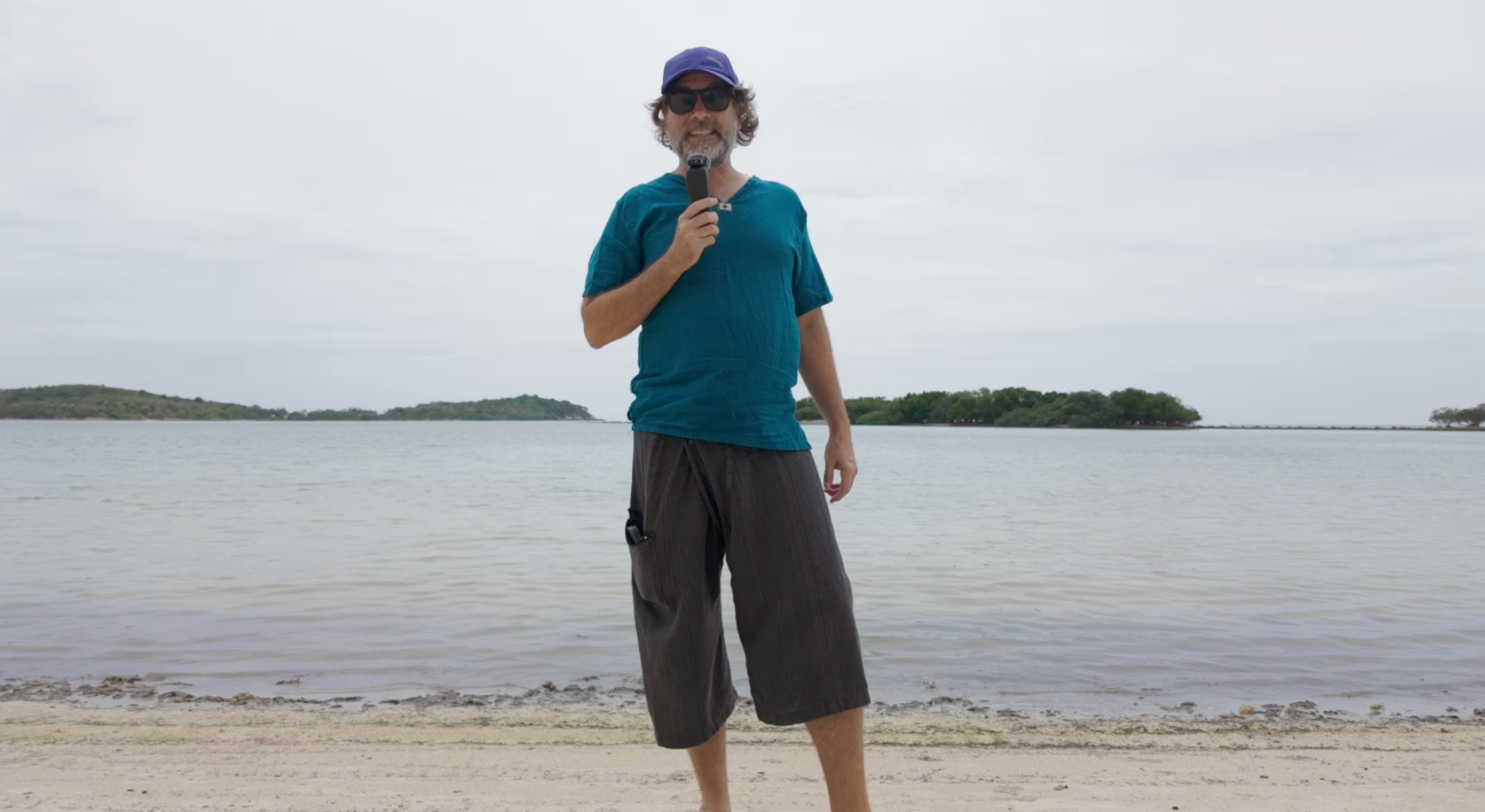 Chris filming a Challenge video on the beach