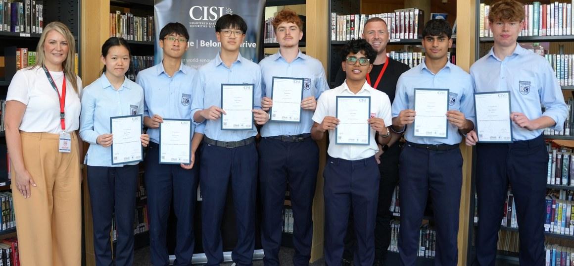 Students holding their CISI certificates