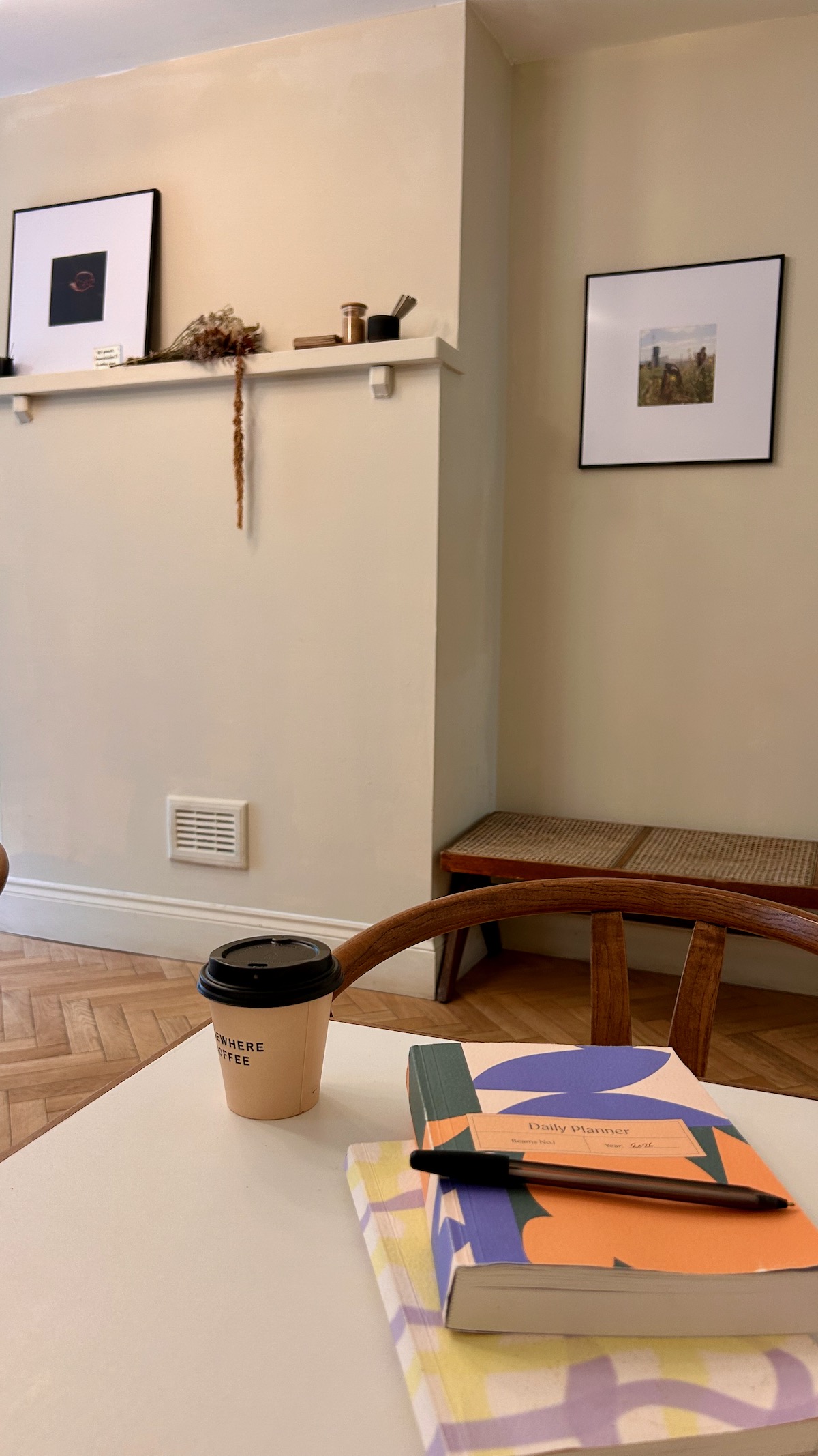 Coffee and notebooks in a calm studio, creative business coaching