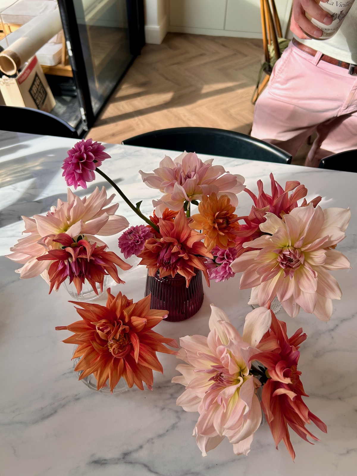 Dahlias in a vase on a marble table, 1:1 coaching for women business owners
