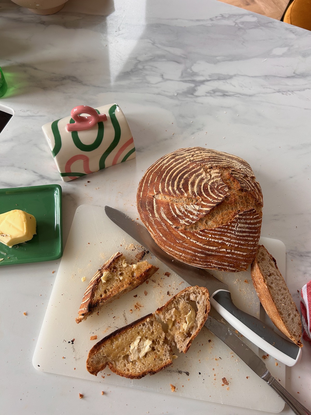 Homemade sourdough on a chopping board, using AI to free up time