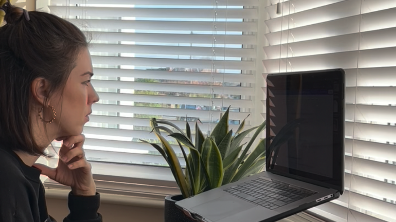 Amy Lord, business coach for creative female founders, focused at her desk