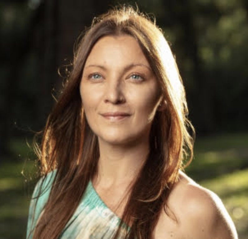 Krista Miller, spiritual healer and dancer, in warm evening light outdoors