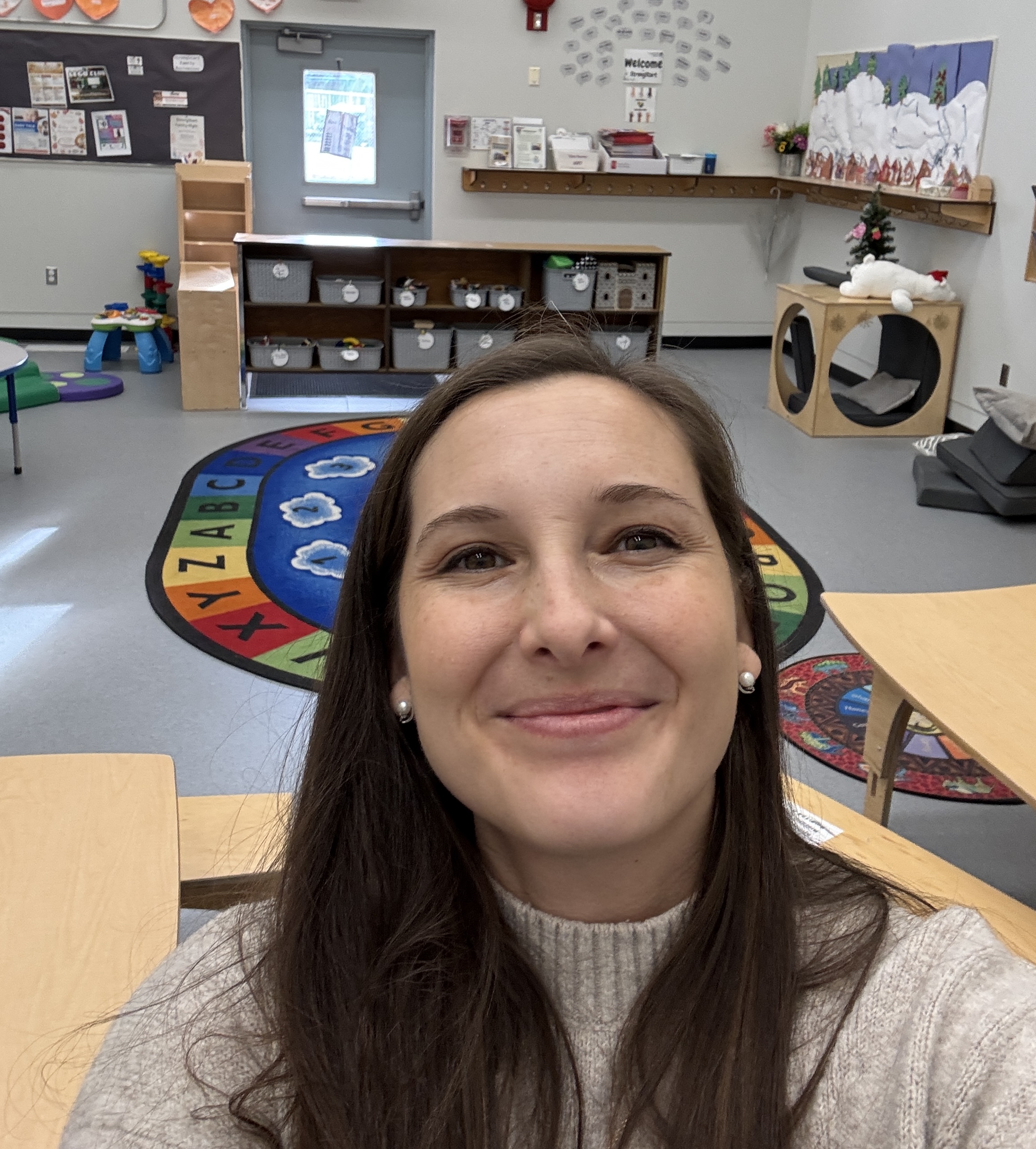 Kierstin smiling in her StrongStart classroom