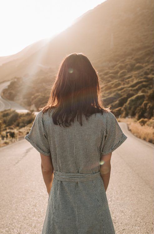 Woman standing on an open road looking ahead representing what you can expect by the end of the Found(N)ation Unlocking YOU program