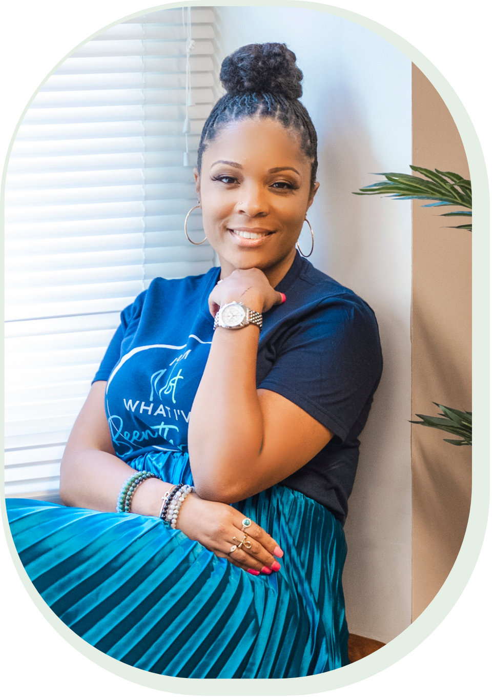 Christina Simmons, LCSW-C, LICSW, in a bright room beside a window