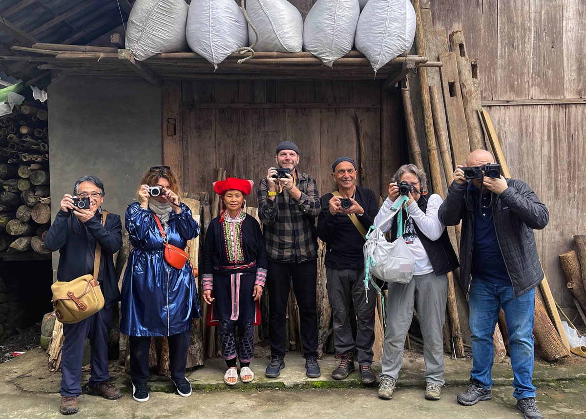 Justin Mott with photography workshop participants and a local woman in northern Vietnam