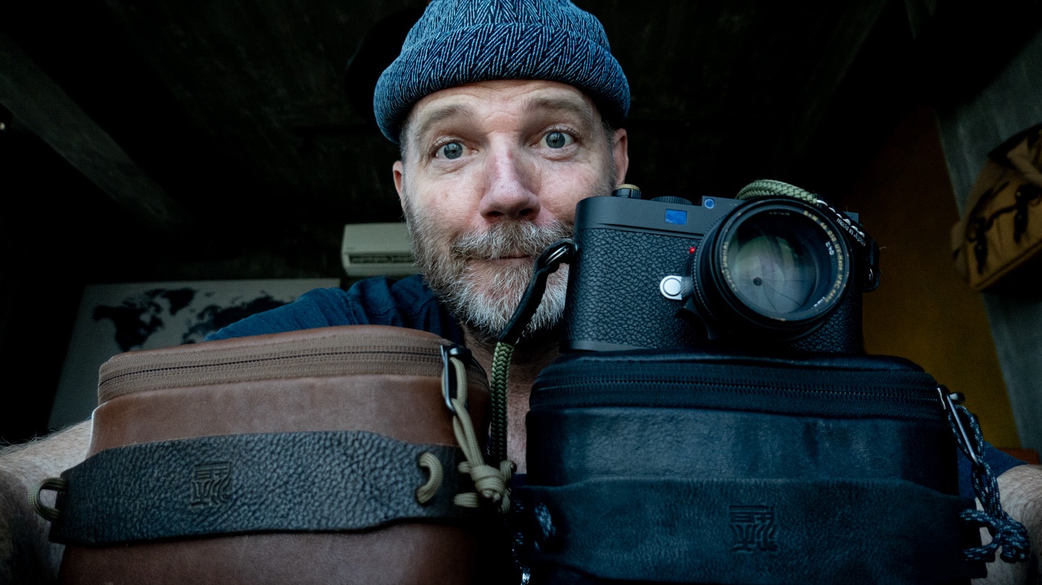 Vietnam based Photogrpaher Justin Mott posing with two Wotancraft leather pouches