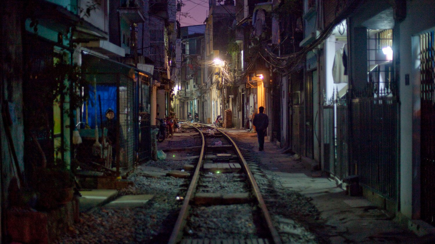 Night alley in Vietnam with railroad tracks - photography study
