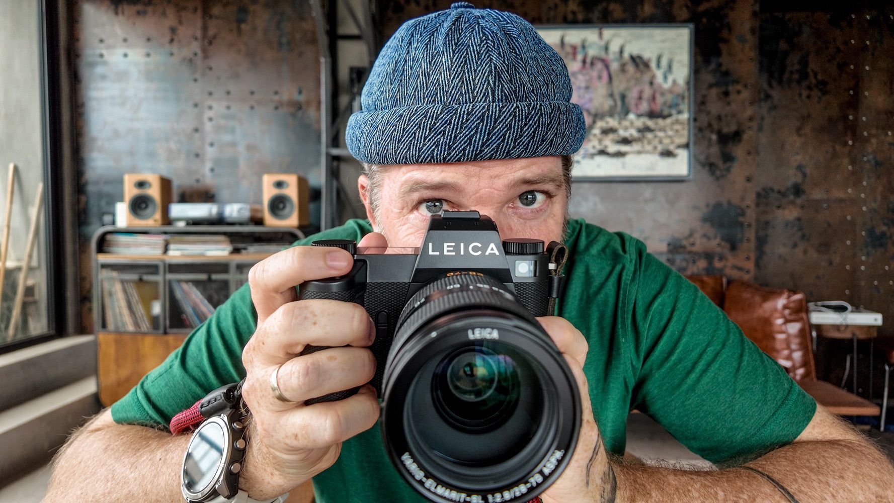 Justin Mott holding a Leica SL3-P at his home in Hanoi, Vietnam. 