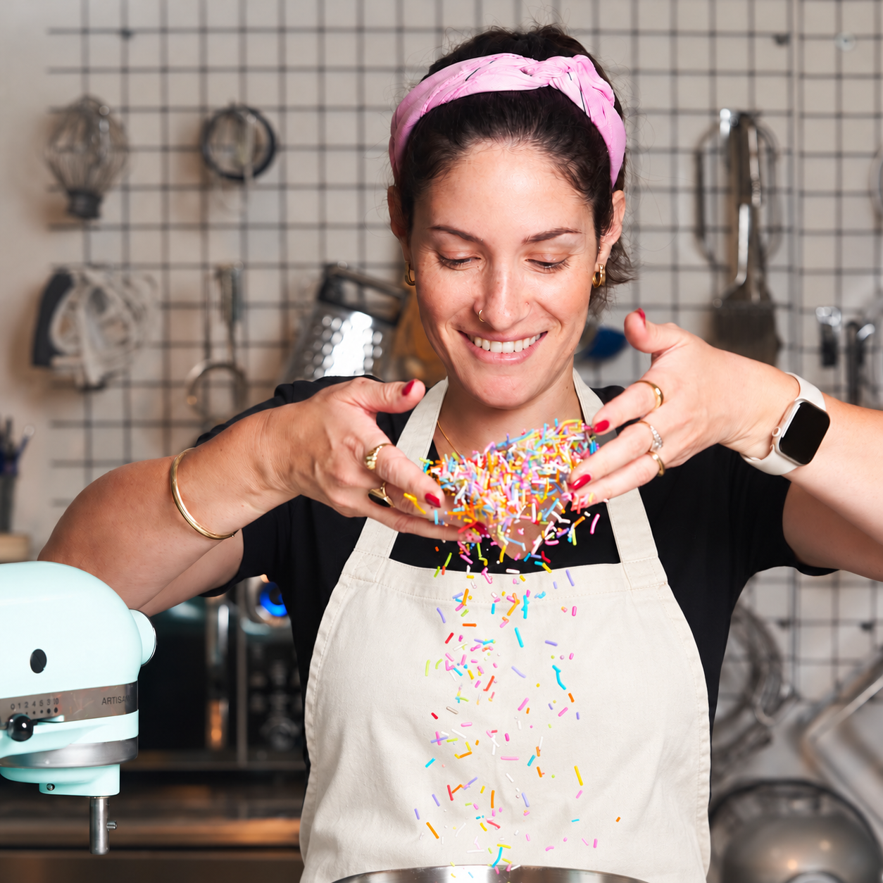 Danielle, vegan pastry chef and instructor, with colorful sprinkles