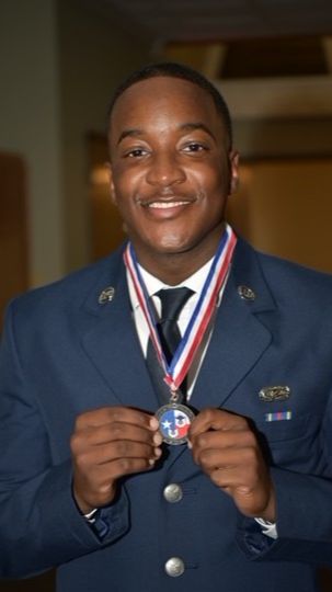 Young service member with medal