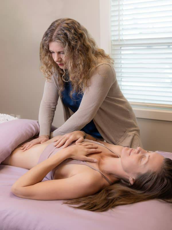 Angela Sunshine Rose providing a Myofascial Release Therapy session to help relieve pain, restore movement, and release fascial restrictions.
