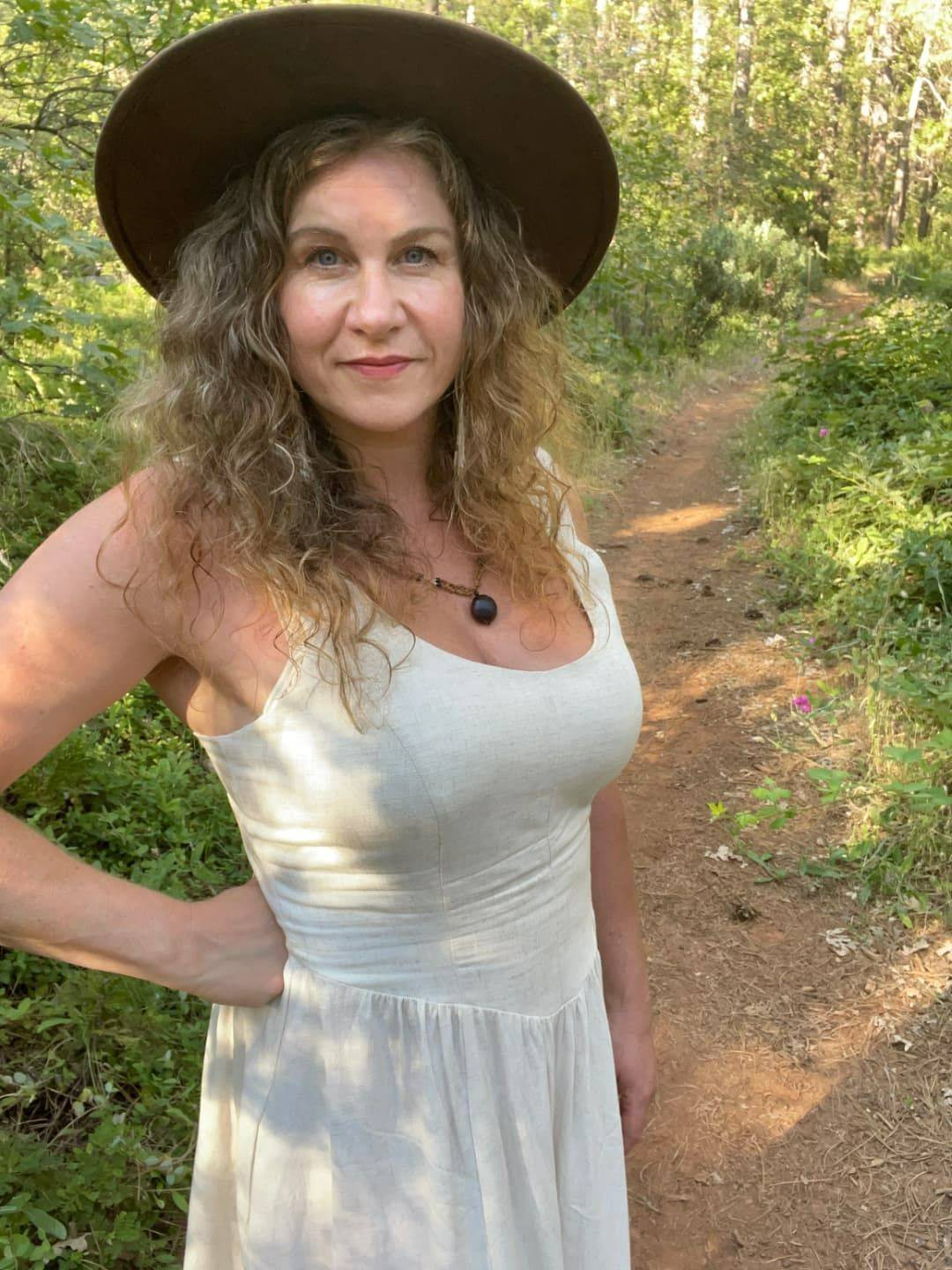 Founder of Sol Bodyworks standing in nature, representing Presence Centered Awareness Therapy, embodied awareness, and nervous system healing.