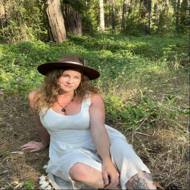 Portrait of Angela Sunshine Rose, founder of Sol Bodyworks and practitioner of Myofascial Release Therapy and Presence-Centered Awareness Therapy.