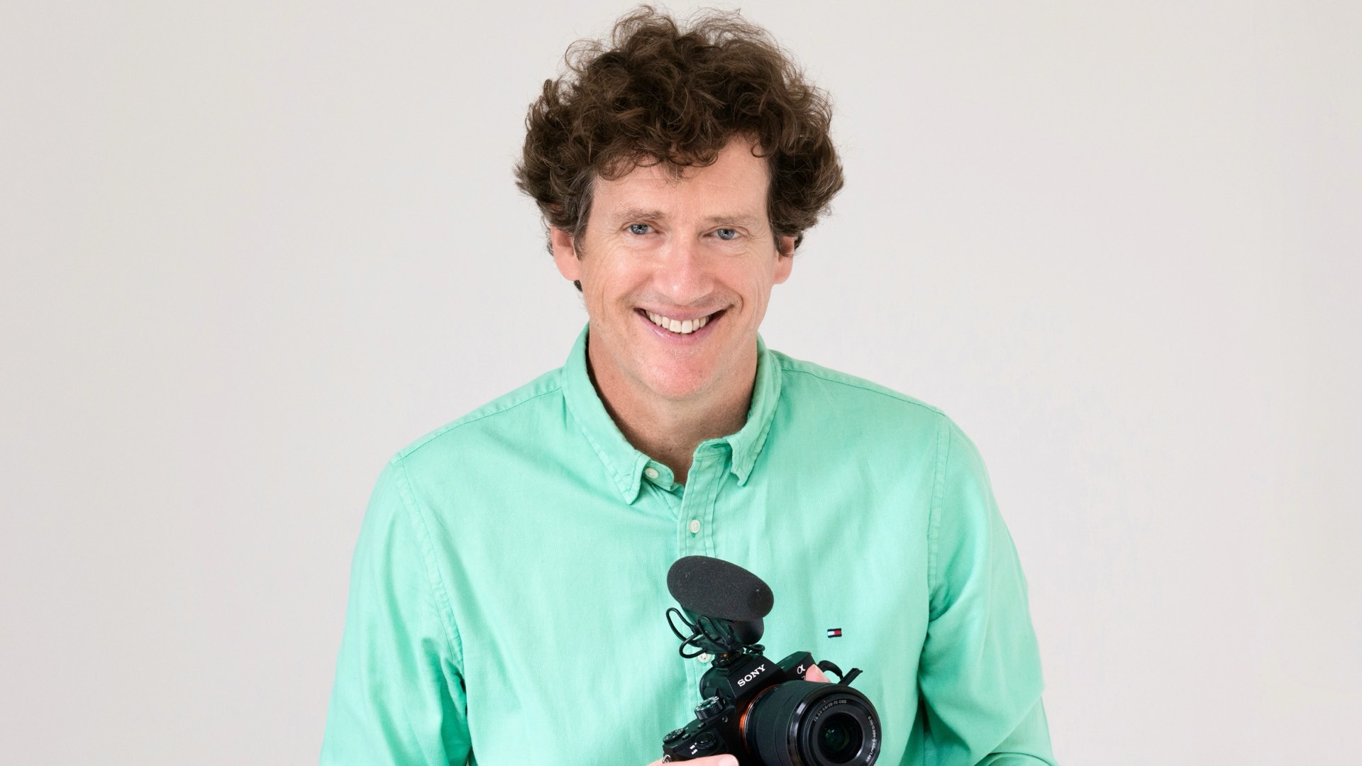 Simon Banks holding a Sony camera