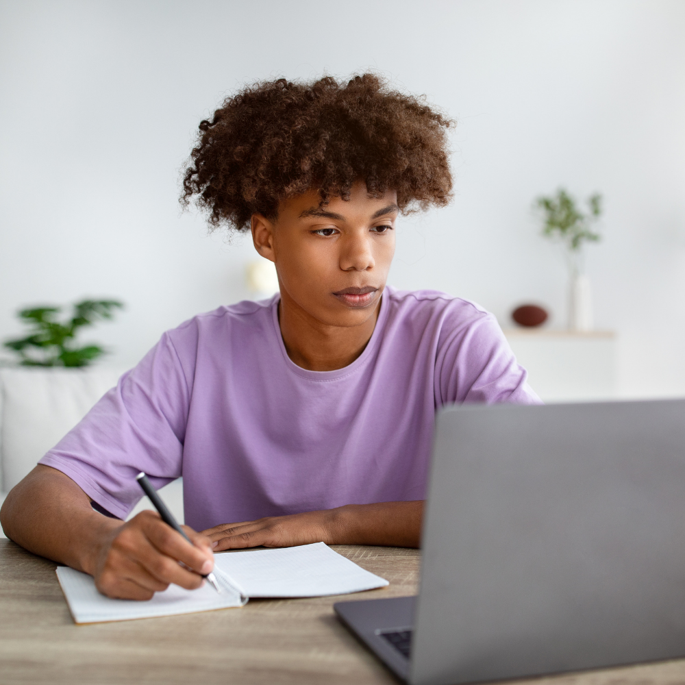 Photo of a boy on laptop using the TACHS Test Prep Course