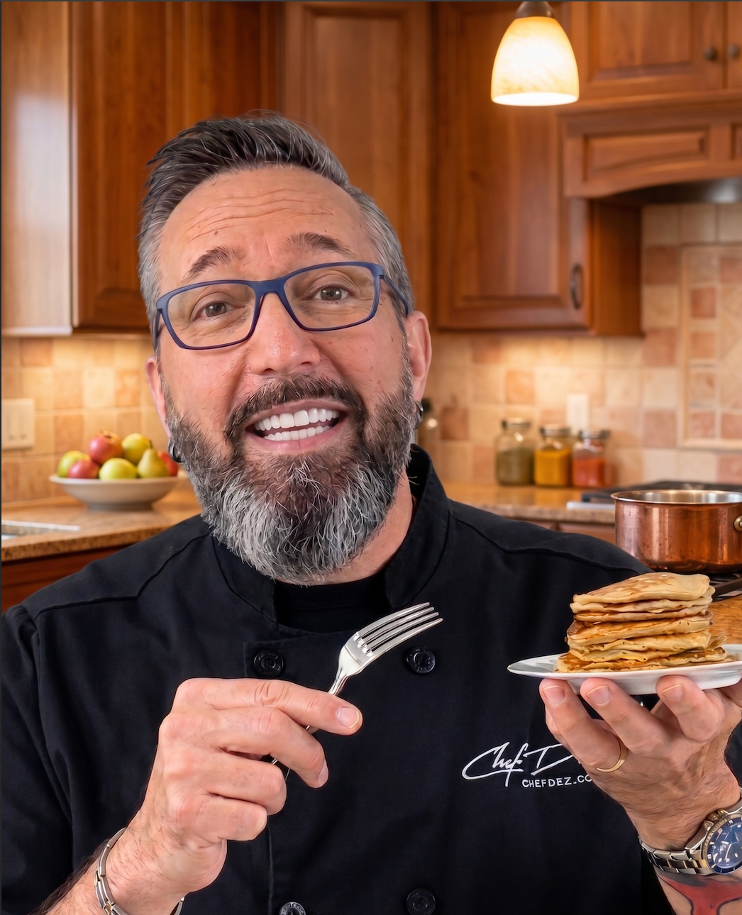Chef Dez teaching practical cooking techniques in the kitchen