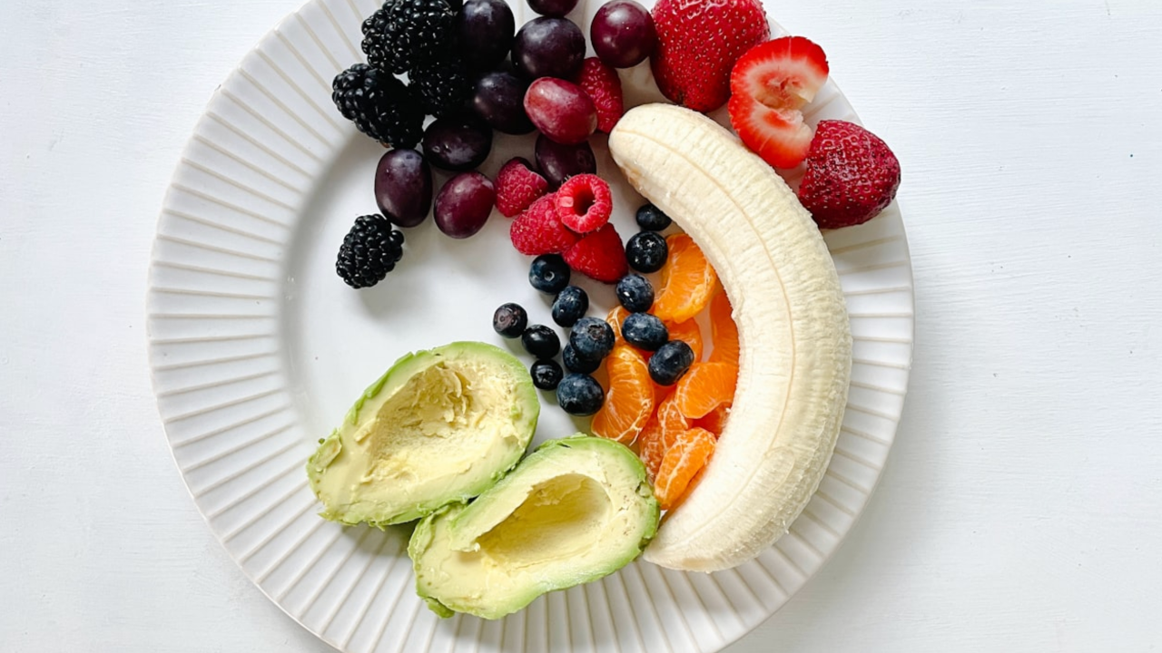 A flatlay of fresh green vegetables and leafy greens, representing gut and microbiome health