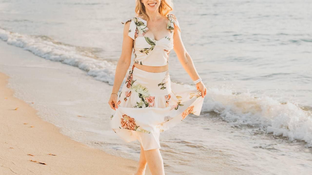 Woman taking a leisurely walk along the beach