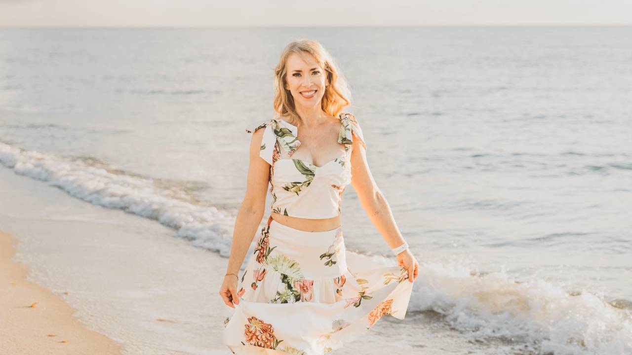 Woman taking a leisurely walk along the beach