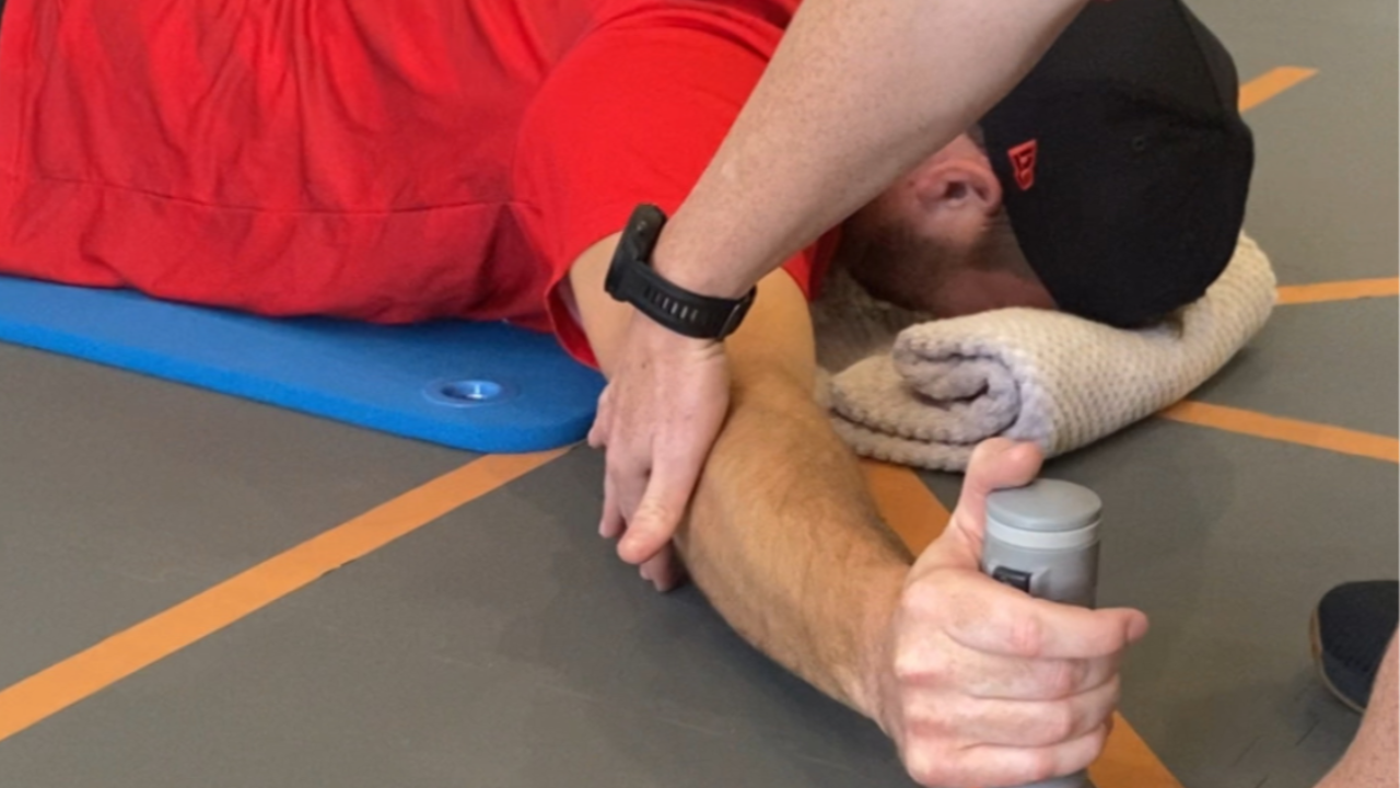 Baseball player testing grip strength